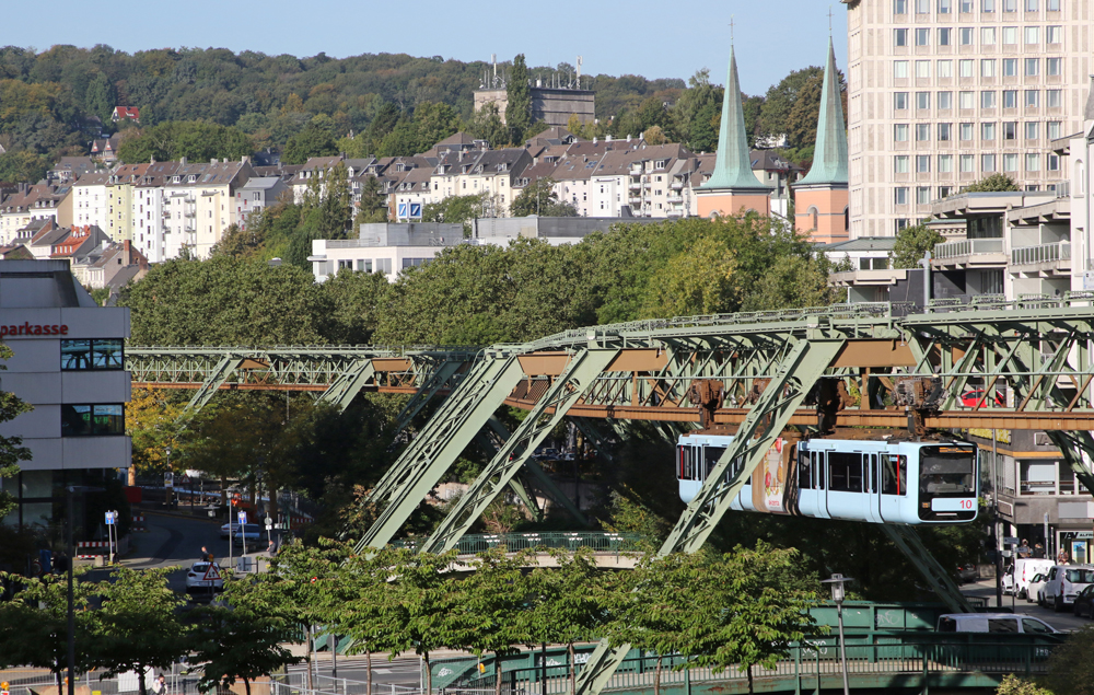 Train suspended from overhead rail.