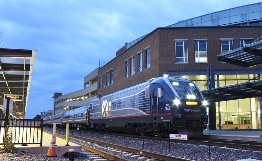 Passenger train at station at twilight