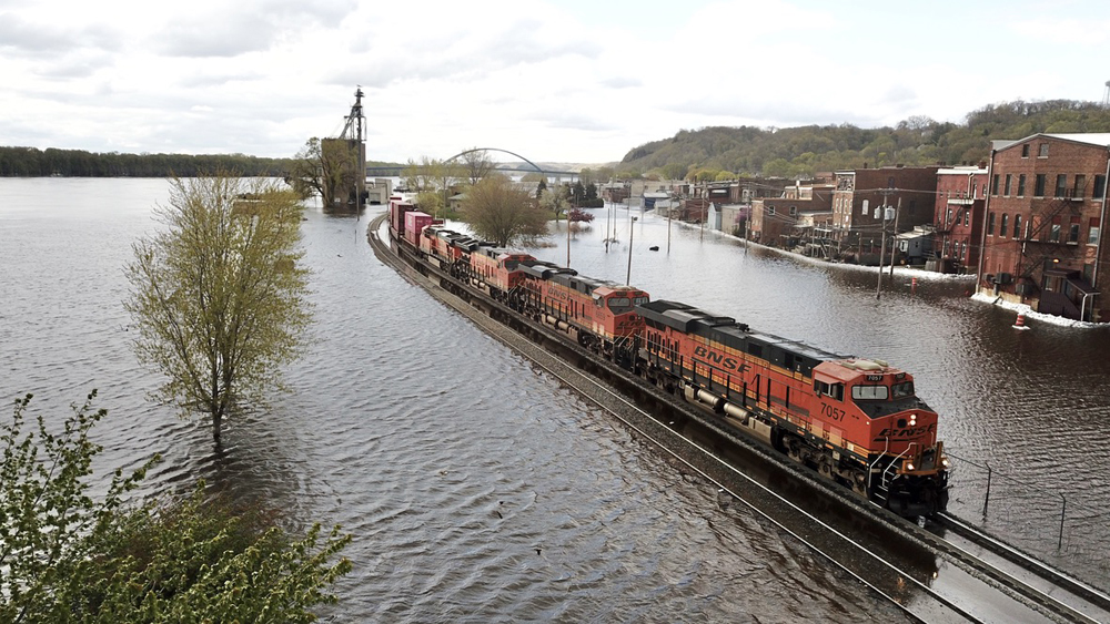 A BNSF train tiptoes through high water at Savanna, Ill., on April 29, 2023. Jeremy J. Schrader.