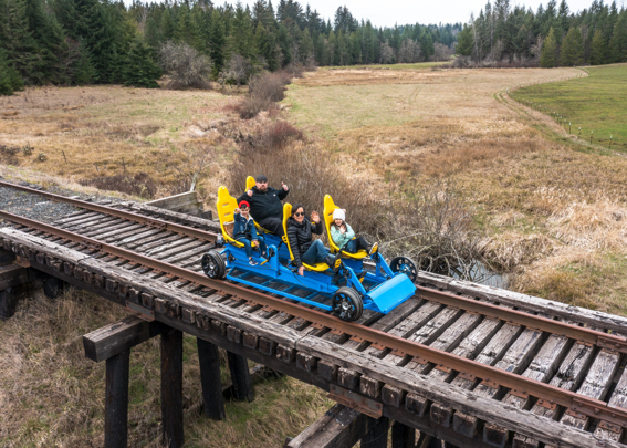 Pedal-powered vehicle on railroad tracks