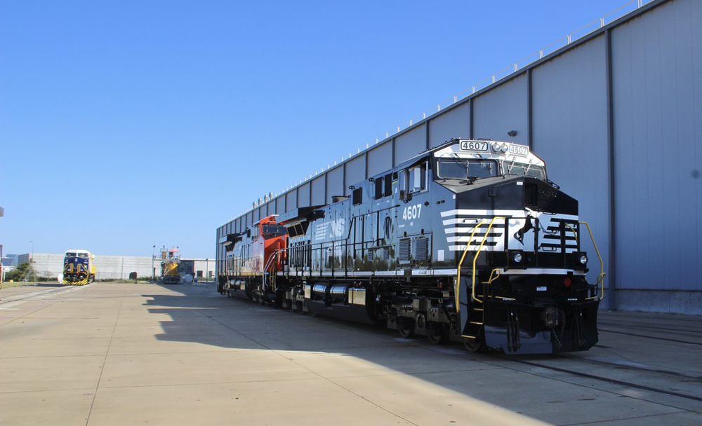 Shiny locomotives outside building