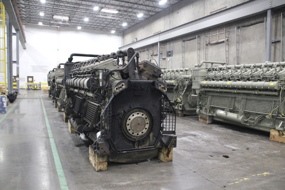Two rows of locomotive engines on factory floor