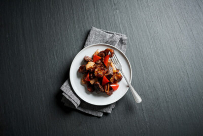 White plate with meal of steak and red peppers. Acela first-class menu upgraded: Analysis  