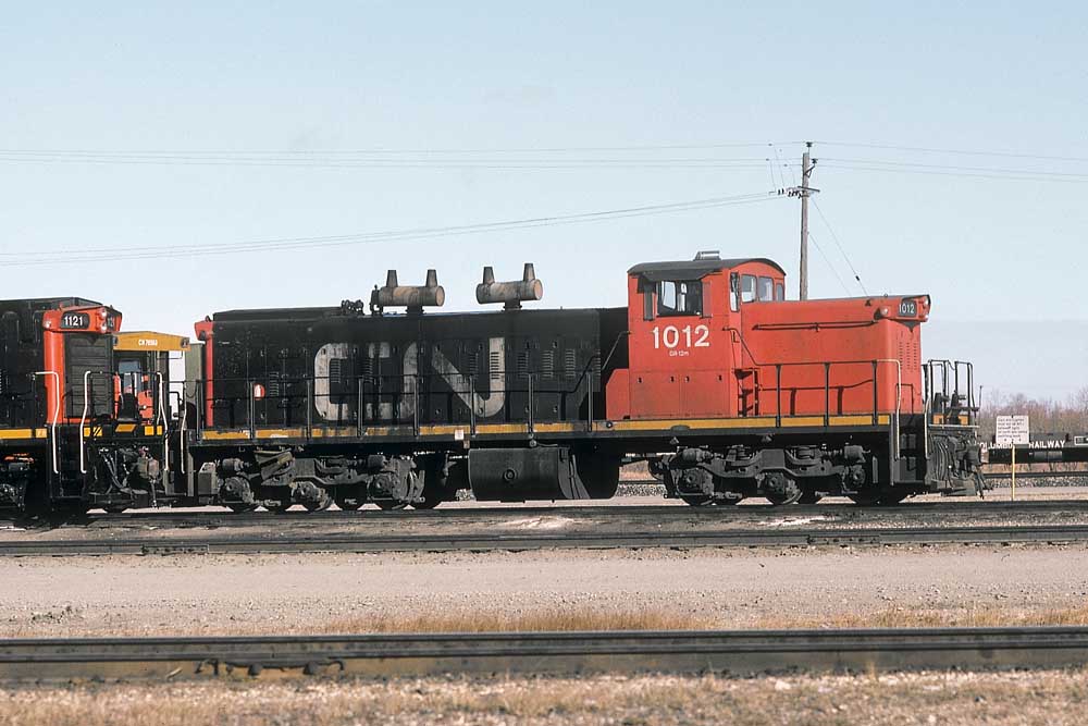 GMD1 diesel locomotive with passenger train and banner on nose