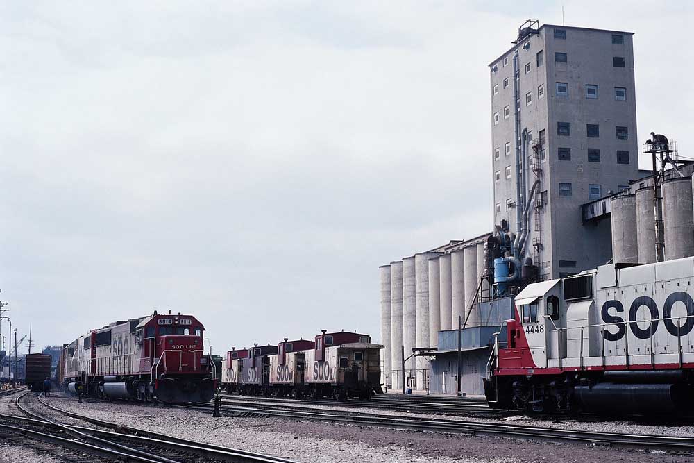 Red-and-white Soo Line history diesel locomotives in yard