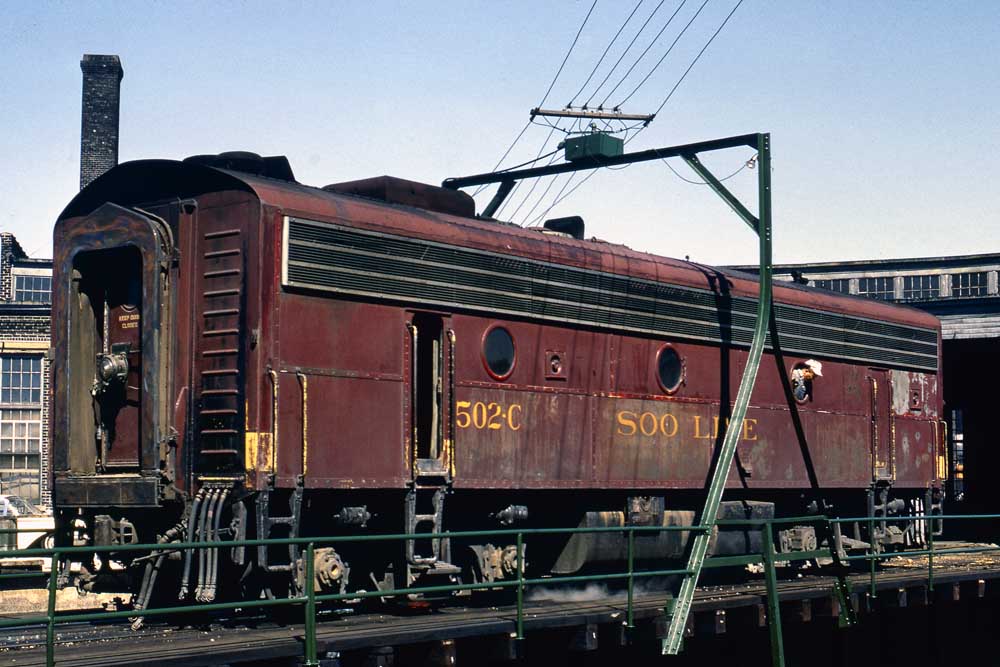 Maroon Soo Line diesel locomotive on turntable