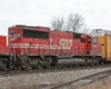 Red-and-white Soo Line diesel locomotive on a freight train