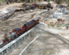 model locomotive on garden railroad loading cattle