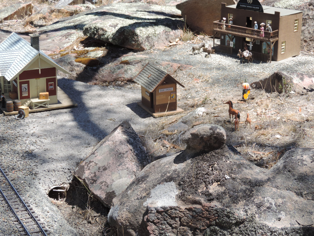 town on a garden railway with rocks
