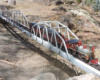 model locomotive crossing steel bridge