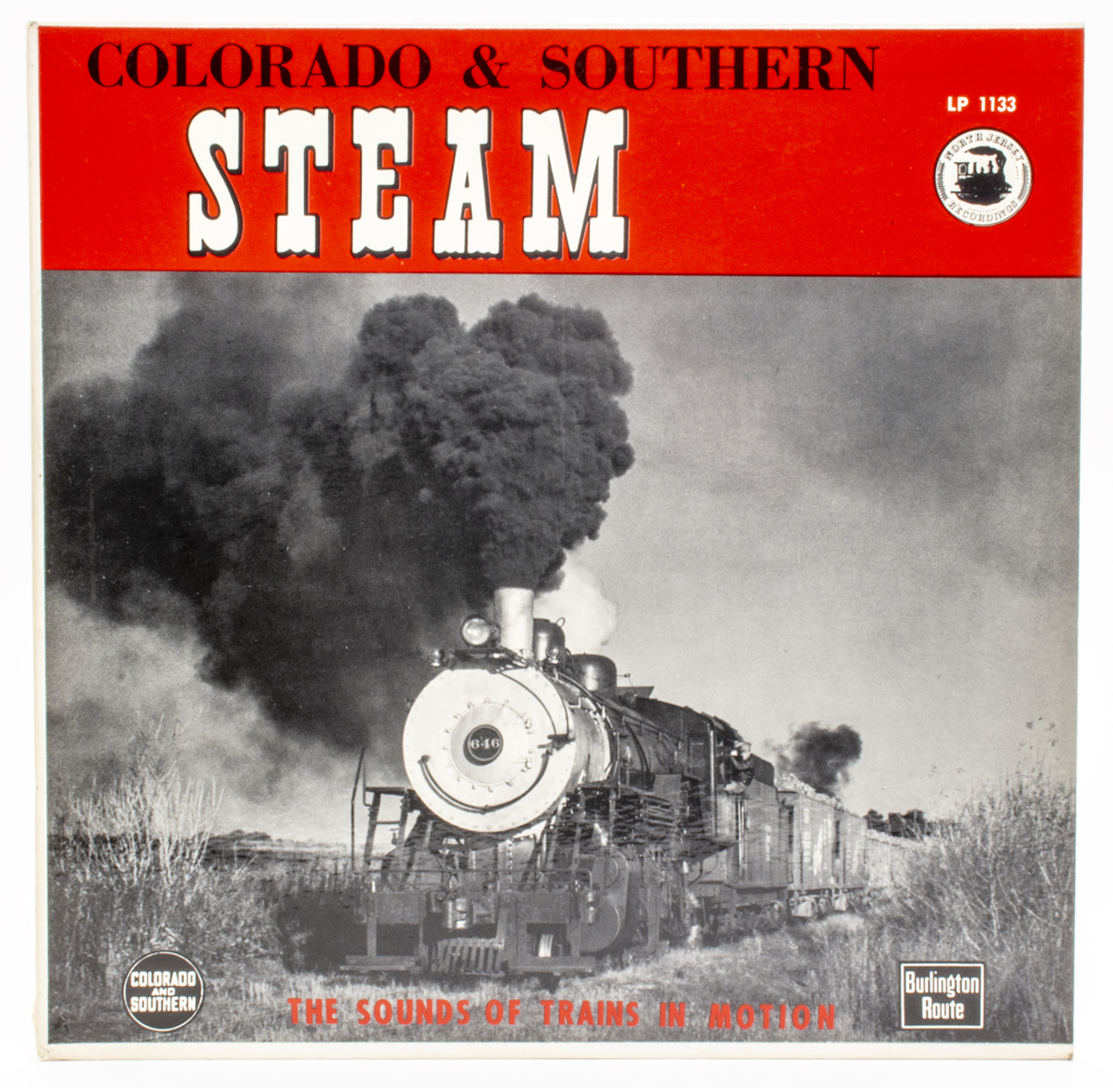 Photo of vinyl record cover with black-and-white photo of a steam locomotive pulling a freight train.