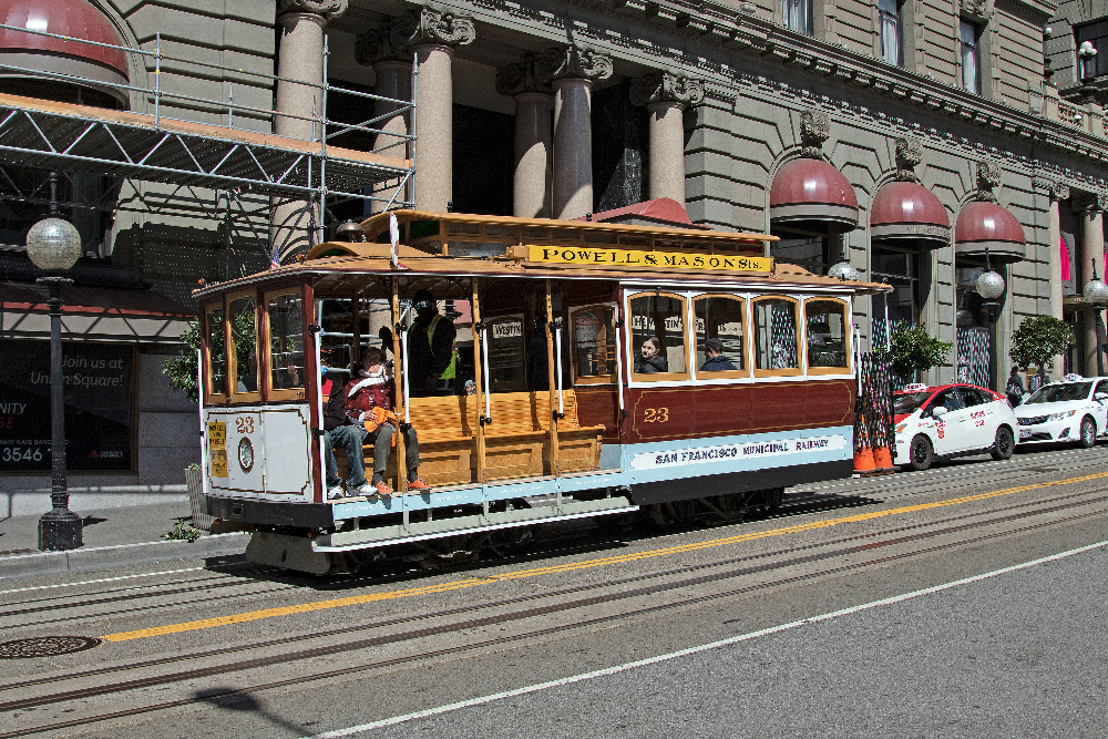 San Francisco cable car running down hill.