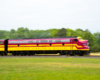 pan photo of red and yellow loco