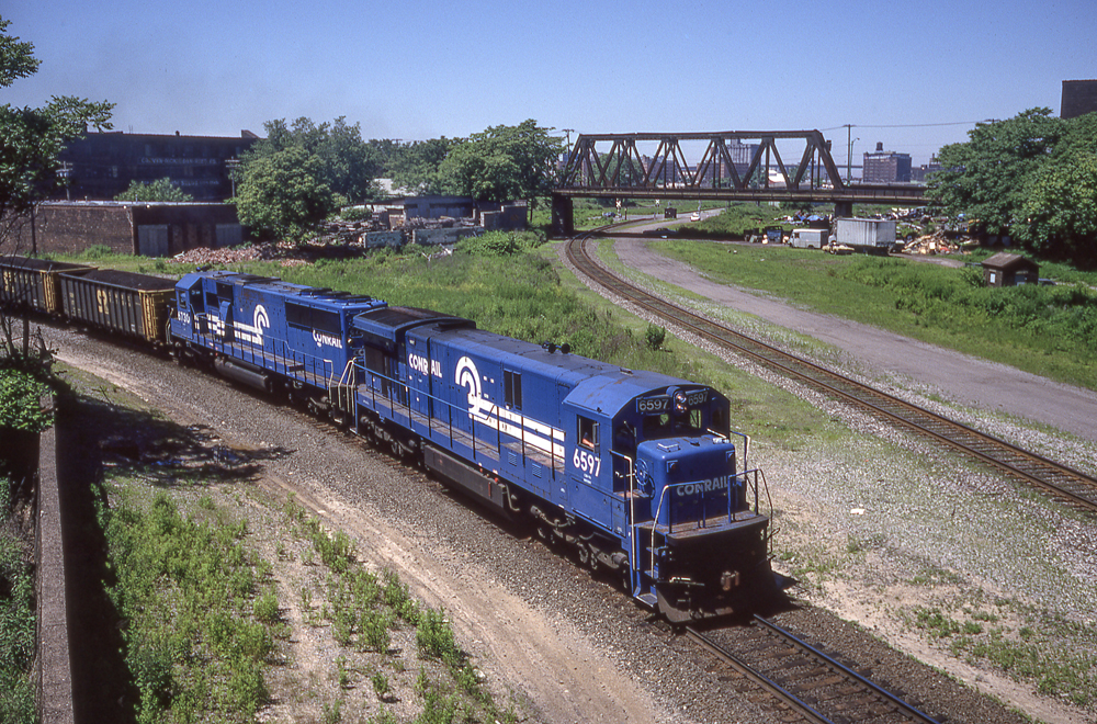 blue Conrail train on track