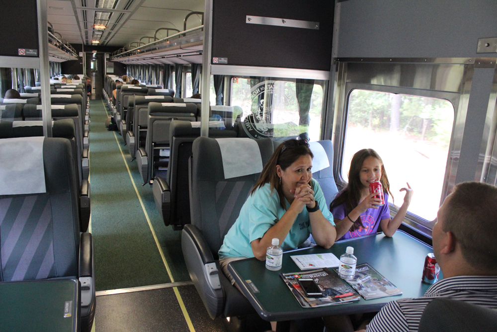 interior view of coach with people at a table