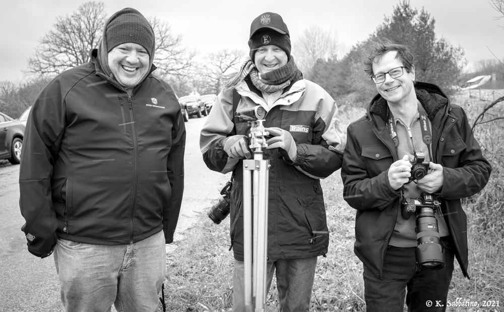 three men at photo charter, black and white photo