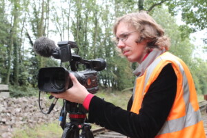 Videographer with camera, video recording train