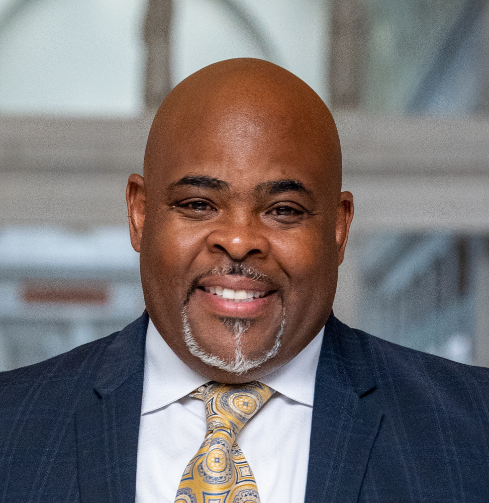 Head shot of man in suit and tie