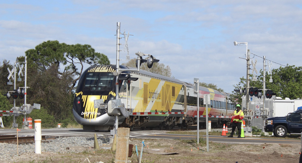 Passenger train at grade crossing