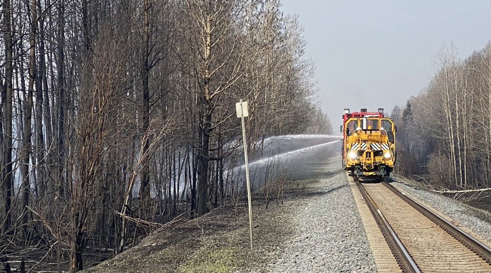 On-track equipment sprays water into trees