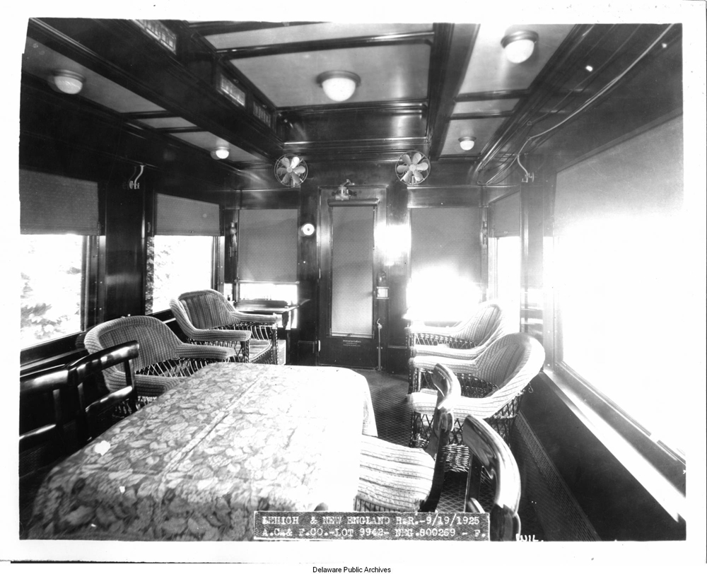 Black and white image of ornate passenger car interior