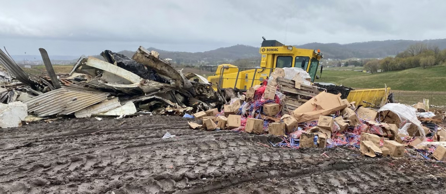 Tractor moves debris at landfill
