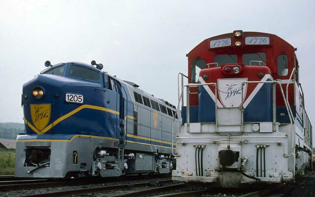 Silver-and-blue diesel Delaware & Hudson locomotives in yard