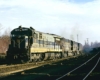 Silver-and-blue diesel Delaware & Hudson locomotives with freight train in yard