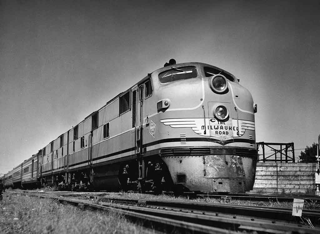 Streamlined diesel locomotive with Milwaukee Road Hiawatha fleet passenger train