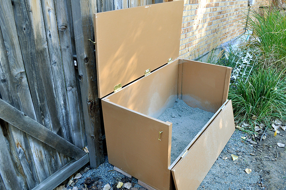 large box of ballast near fence