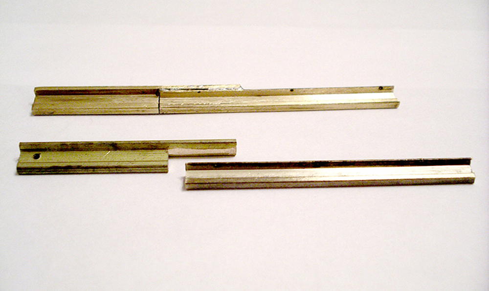 two pieces of metal rail