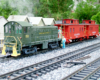 two red cabooses being pushed by a green switcher