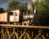 A geared steam engine on a wood trestle gleams in the low light