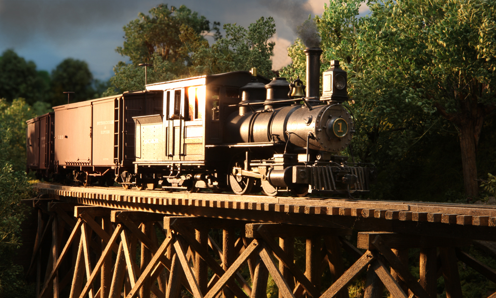 A geared steam engine on a wood trestle gleams in the low light