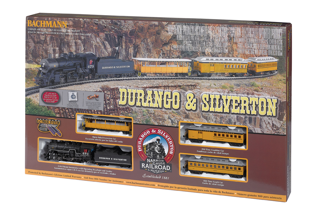 Train set box with black steam locomotive and three yellow passenger cars