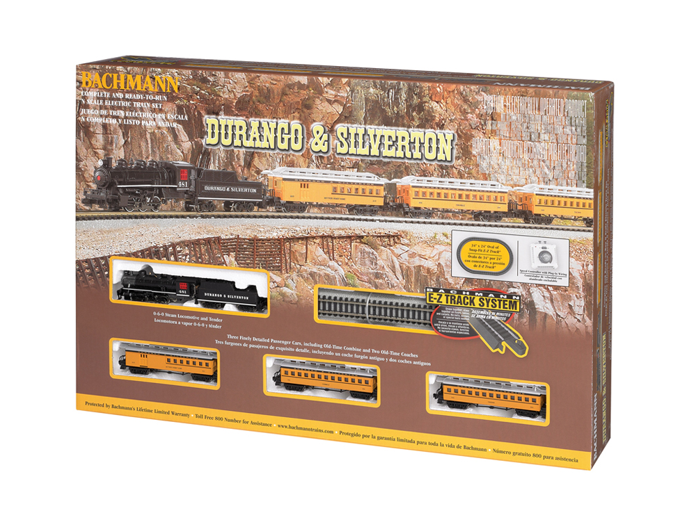 Train set box with black steam locomotive and three yellow passenger cars