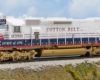 Color photo of HO scale road locomotive on scenic base.