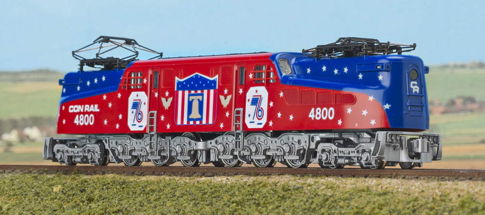 Color image of electric locomotive in patriotic paint scheme.