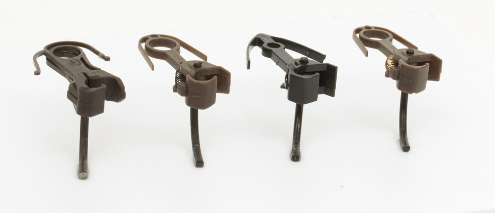 Color photo of plastic HO scale knuckle couplers.