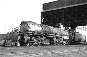 Black and white photos of a large black steam locomotive taking coal. More of the Big Boy story