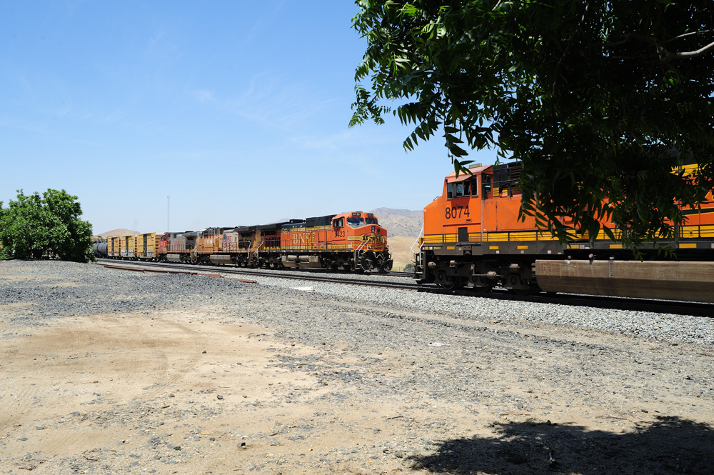 two BNSF orange trains
