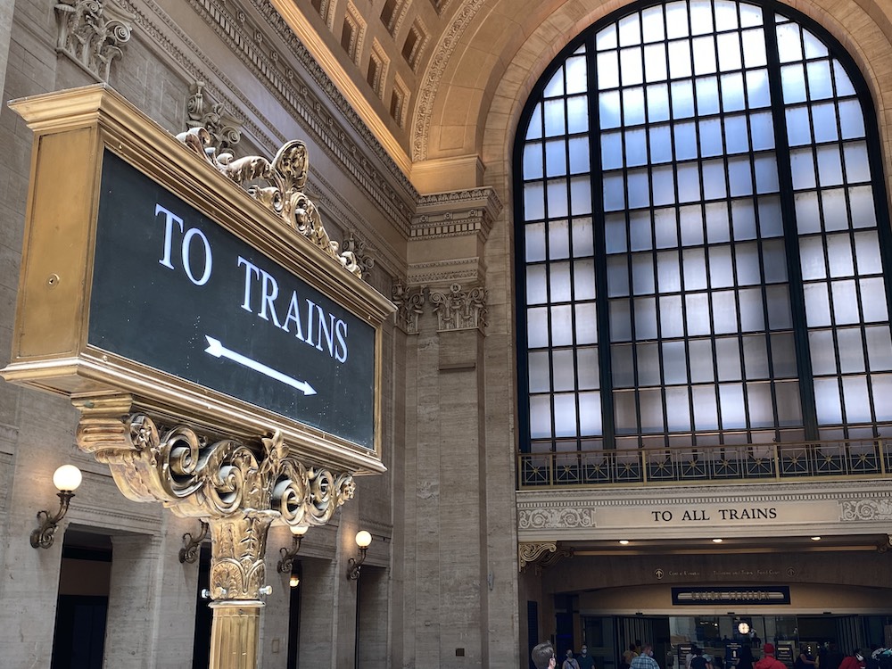 “To Train” sign at a train station