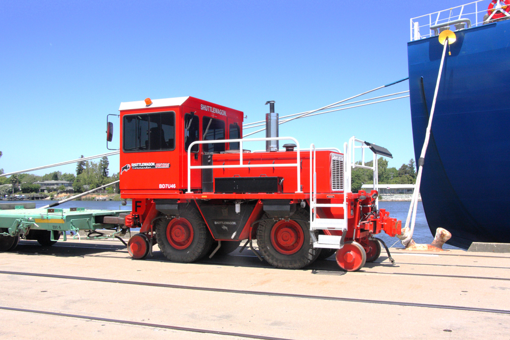 red railcar mover with blue sky