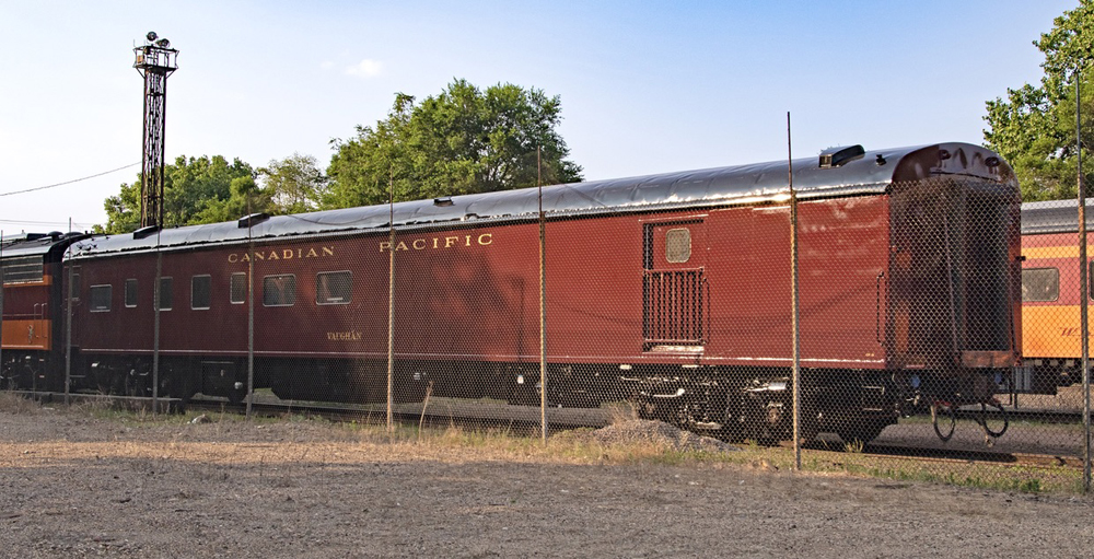 Maroon tool car used for mainline steam excursion.