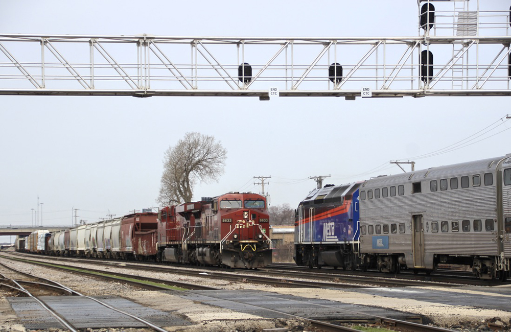 Canadian Pacific and Metra trains meet at a grade crossing in Franklin Park, Ill., on April 2, 2023. Franklin Park will receive up to $8 million from the FRA for a grade crossing separation project under funding announced Monday, June 5. David Lassen