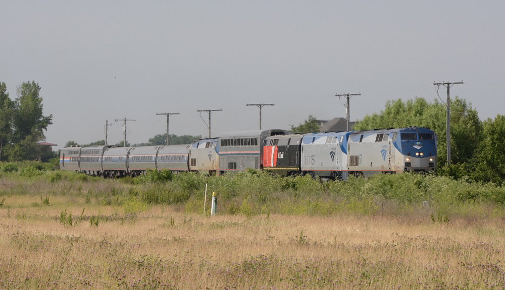 Train with mixed group of locomotives and passenger cars