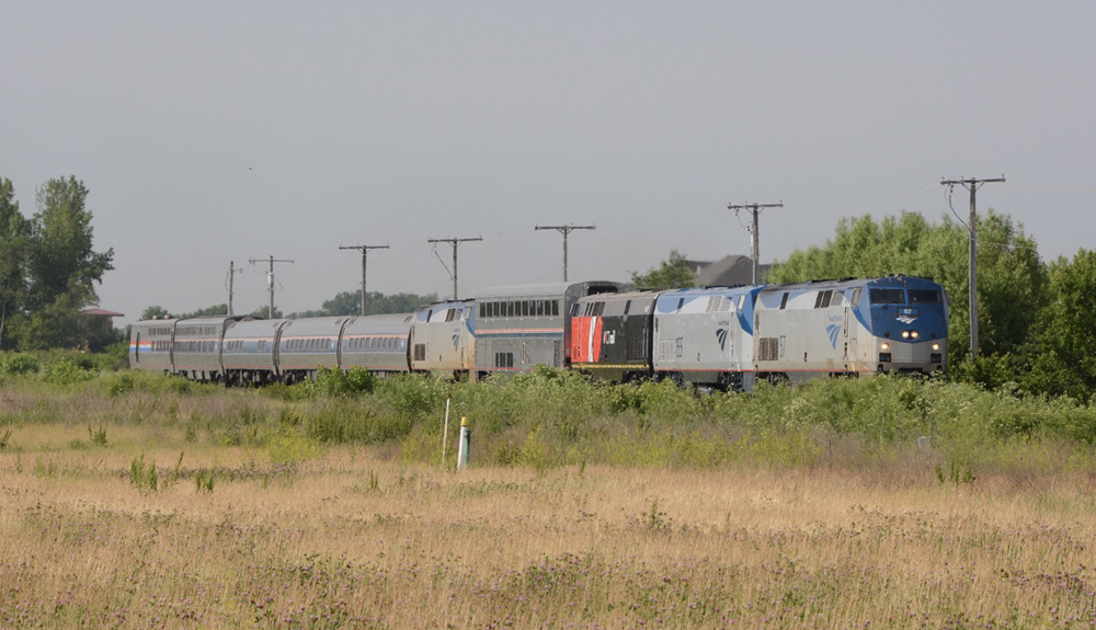 Train with mixed group of locomotives and passenger cars