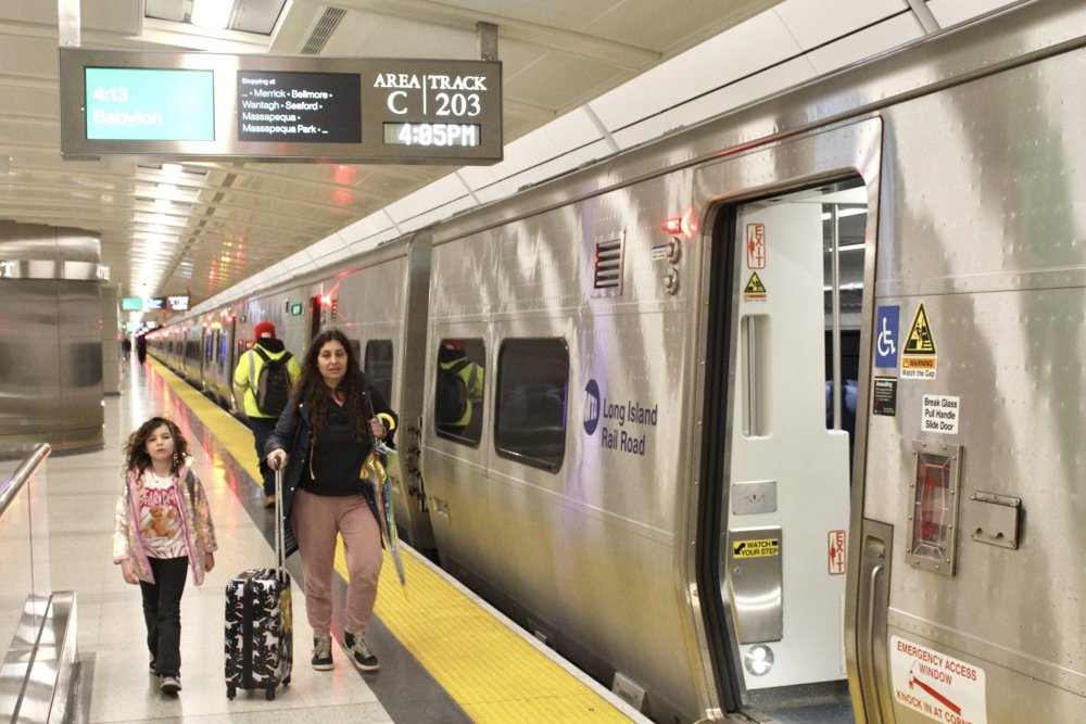 People walking on platform after arriving at station