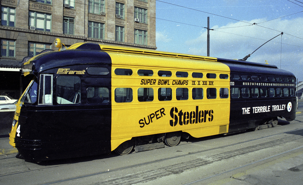 Black and yellow PCC trolley car with Pittsburgh Steelers lettering