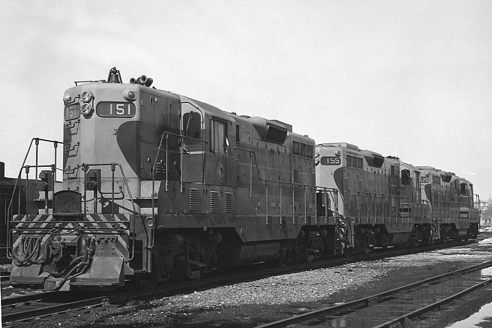 Three Algoma Central Railway diesel locomotives in rail yard